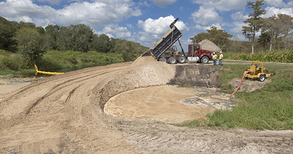 people working dump truck