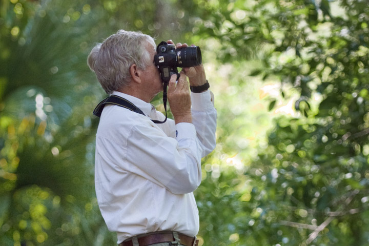 Man looking through binoculars.