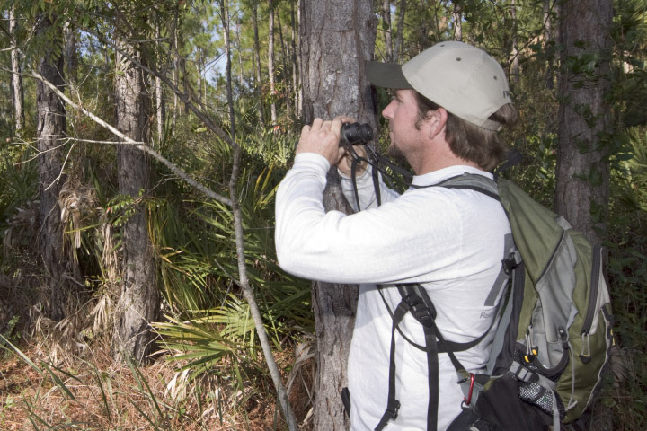 Man looking through binoculars.